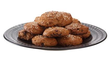 Fototapeta premium Homemade oatmeal cookies with nuts, chocolate chips and sesame. Isolated on white background.