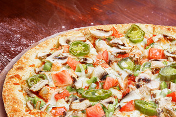 classic Italian pizza on a wooden tray, served in a small authentic Italian restaurant