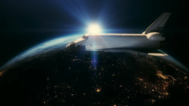 Space shuttle in orbit above earth