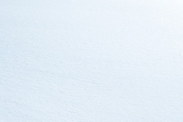 Fresh snow background texture. Winter background with snowflakes and snow mounds. Snow lumps.