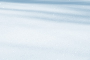 Fresh snow background texture. Winter background with snowflakes and snow mounds. Snow lumps.