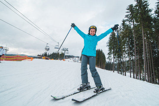 wide angel picture of skiing young adult woman