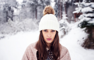 Winter portrait of young beautiful brunette woman