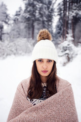 Winter portrait of young beautiful brunette woman