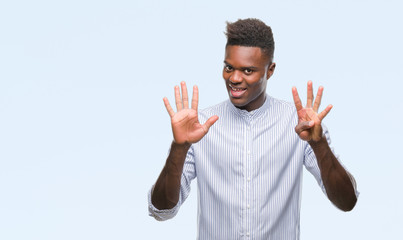 Young african american man over isolated background showing and pointing up with fingers number nine while smiling confident and happy.