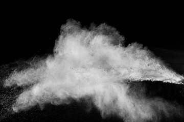 Abstract white powder explosion against black background.Abstract white dust exhale.