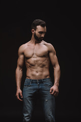 Fototapeta premium sexy shirtless man posing isolated on black
