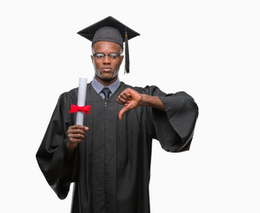 Young graduated african american man holding degree over isolated background with angry face, negative sign showing dislike with thumbs down, rejection concept