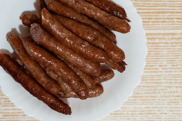 Grilled sausages on a plate.