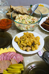 Table covered with various meals.