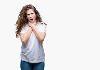 Beautiful brunette curly hair young girl wearing casual t-shirt over isolated background shouting and suffocate because painful strangle. Health problem. Asphyxiate and suicide concept.