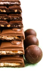 chocolate with nuts isolated on white,food,sweet,brown,candy,dessert,isolated,sweets,delicious,chocolates,dark,closeup,sugar,tasty,milk,eat,gourmet,cocoa,nut,nuts,white