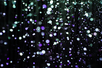 Abstract texture and background of colorful glittering bokeh lights with black background