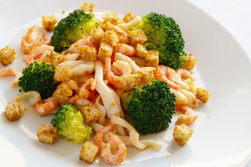 steamed broccoli and fried calamari and prawns salad with spicy white bread croutons