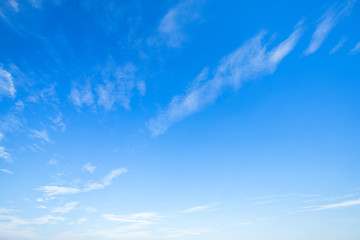 Naklejka na ściany i meble blue sky background texture with white clouds.