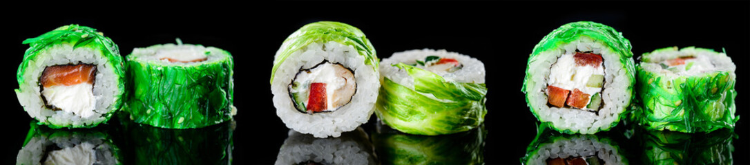 sushi rolls with chuka on a dark background