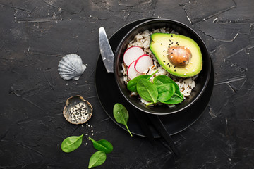 Vegetarian dish. Avocado, vegetables, rice bowl. Healthy food for all. Without meat. Top view