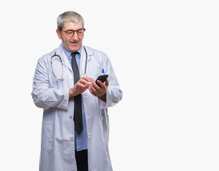 Handsome senior doctor man texting sending message using smarpthone  over isolated background with a happy face standing and smiling with a confident smile showing teeth