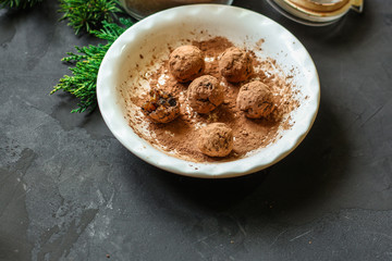 candy dressing  cocoa (dried fruit filling) sweets on a dark background. Top view. copy space