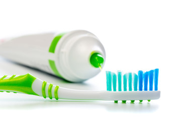 toothbrush and toothpaste tube on an isolated background
