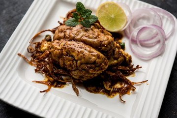 Brain / Bheja Fry of goat, sheep or lamb is a popular Indian or pakistani dish cooked on Bakra Eid(Eid-ul-zuha). served in karahi, pan or plate. selective focus