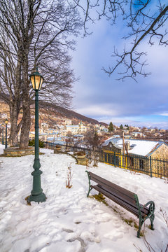 View of traditional stone buildings and streets with snow at the famous village of Nymfaio near Florina, Greece. 