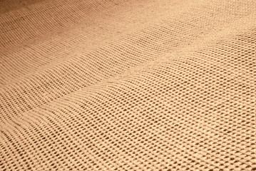 Abstract texture at angle flowing from right to left with focus at front. Neutral colour