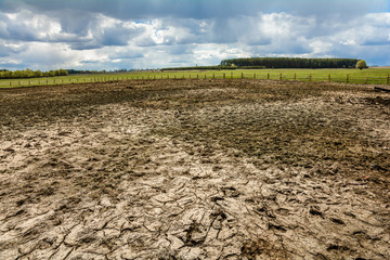 Spring in the village. Sowing works are conducted on the fields.