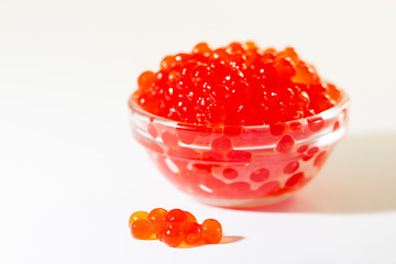 red caviar in glass bowl isolated on white background