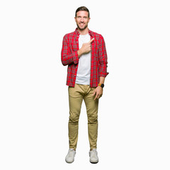 Fototapeta premium Handsome man wearing casual shirt cheerful with a smile of face pointing with hand and finger up to the side with happy and natural expression on face