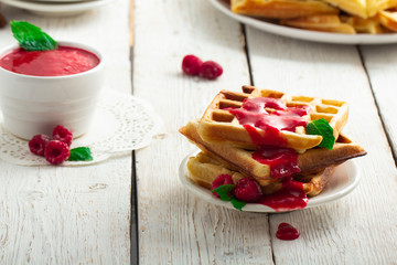 Homemade belgian waffles with berries for breakfast. Closeup