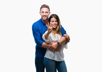 Young couple in love over isolated background showing and pointing up with fingers number four while smiling confident and happy.