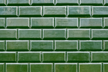 Old green tile brick wall background texture - 241601082