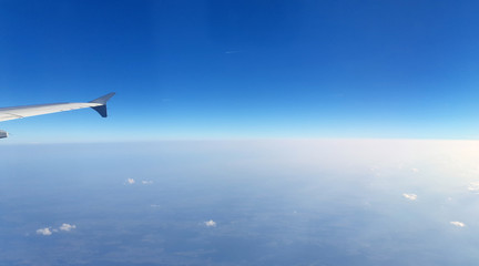 Fototapeta na wymiar View over the window in aeroplane