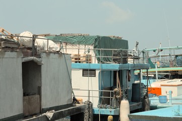 Ruined boat in the harbor of Male (Maldives)