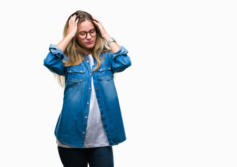 Young beautiful blonde woman wearing glasses over isolated background suffering from headache desperate and stressed because pain and migraine. Hands on head.