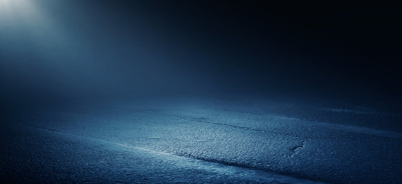 The background of wet asphalt, the reflection of the night lights of the city, neon light, smoke