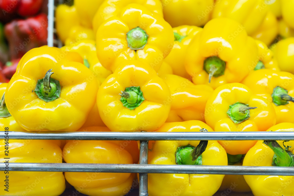 Wall mural yellow pepper on the shelf of the super market, exhibited for sale.