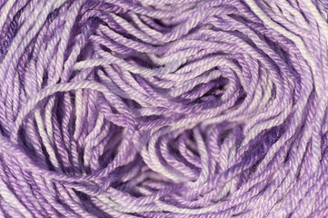 Abstract of skein of pale violet melange knitting thread close up