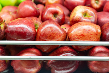 red apple on super market shelf, exhibited for sale