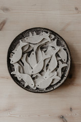 Decorative clay plates, on a wood background with copy space.