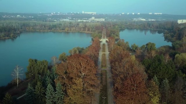 Aerial footage over Echo Park Lake, Kishinev, Moldova republic of. View of lake and smille bridge.