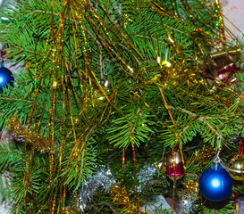 Tree branches are decorated with toys for the new year holiday.