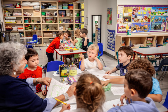 Teacher and children in a classroom