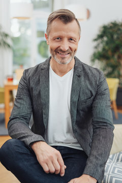 Front portrait of man in blazer and white t-shirt