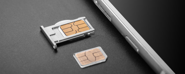 mobile phone and sim card © Olexandr