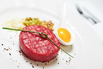 Beef tartare with egg yolk / closeup