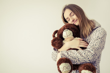 Teen girl with teddy bear