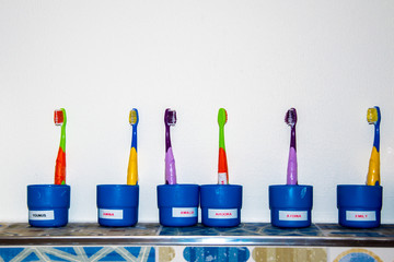 Toothbrushes in glasses ,Concept of dental hygiene in kindergartens