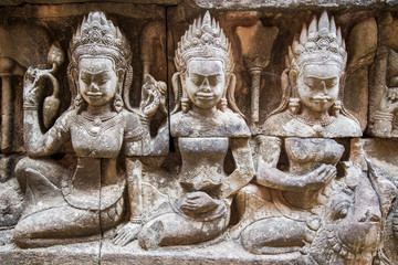 Ancient ruins and bas relief in Siem Reap Park, Cambodia